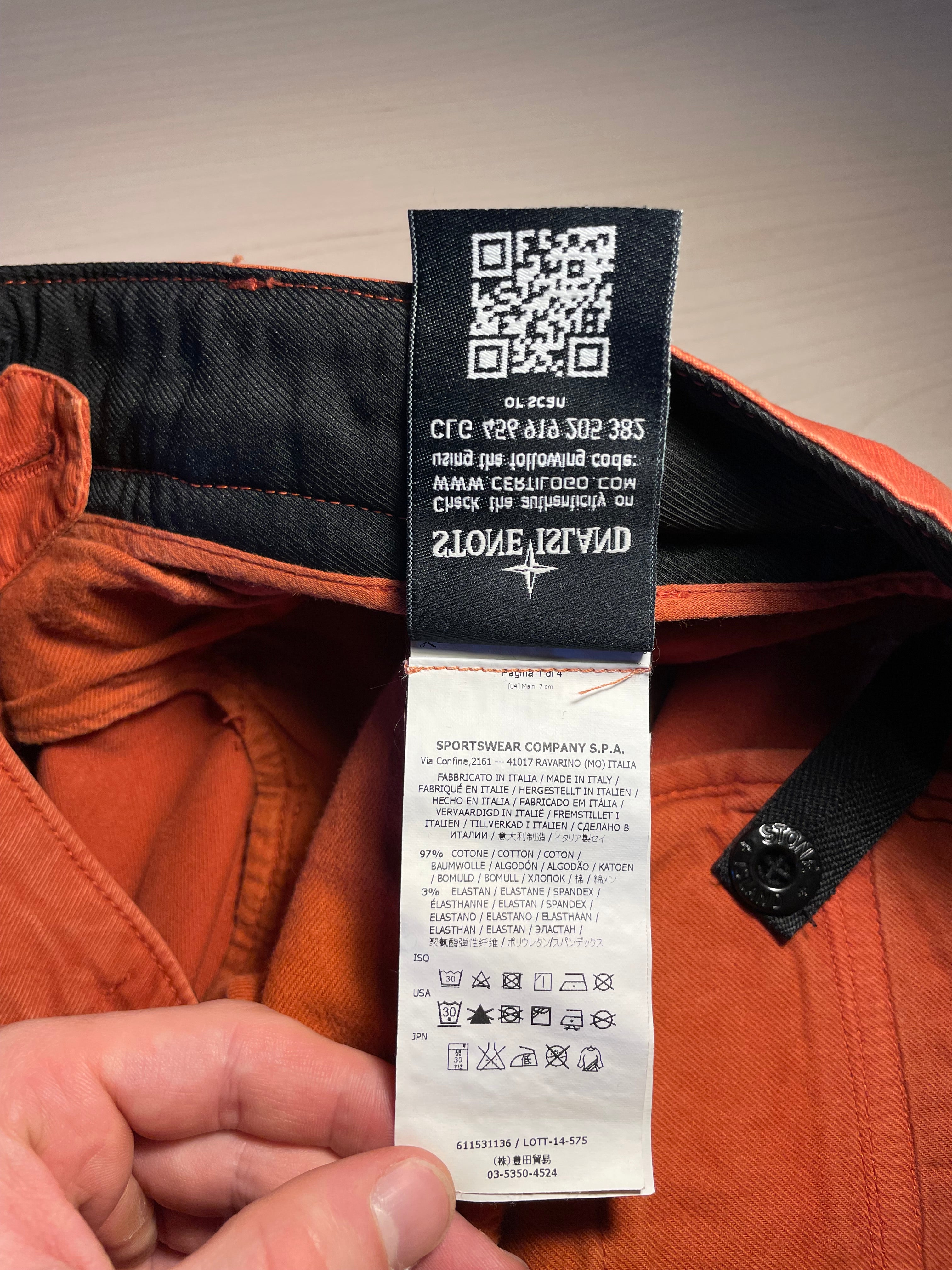 Pantaloni Stone Island arancioni logo retro