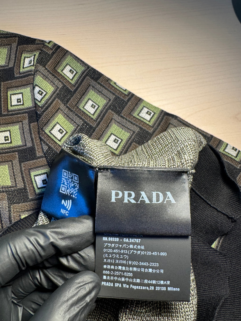 Polo in seta Prada